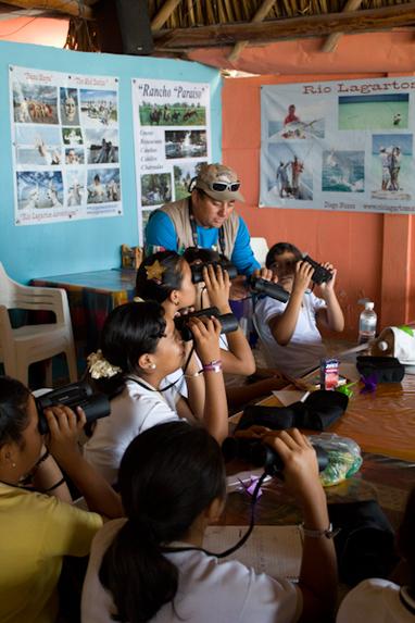 Diego Nuñez teaching a birding class to the children of Rio Lagartos